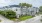 a building with trees and grass