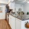 a kitchen with white cabinets