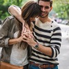 a couple walking through a park