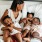 a woman on a bed with her children
